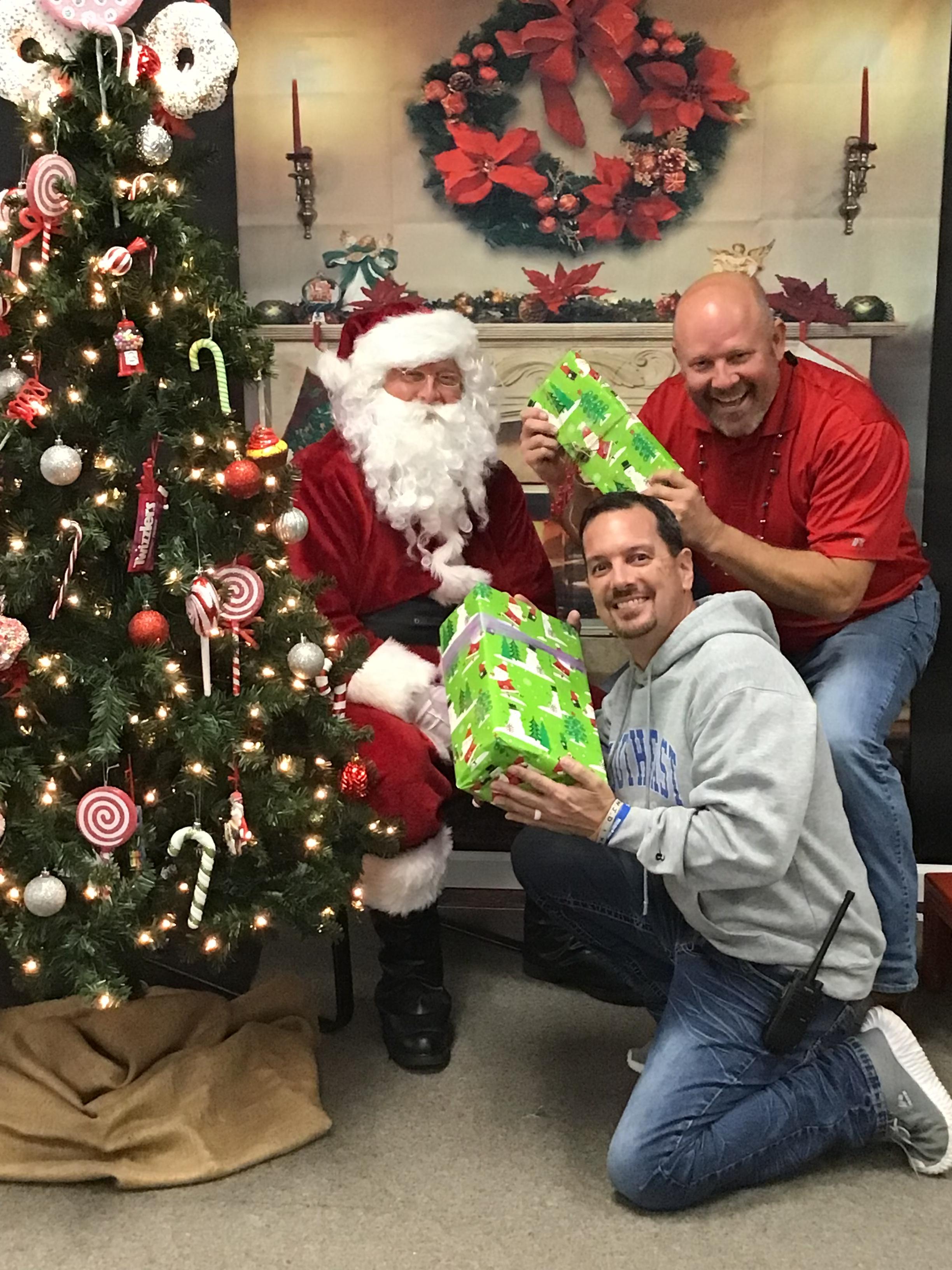 Mr. Powell and Dr. Holfield with Santa