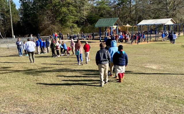 Students on the playground for a fire drill 